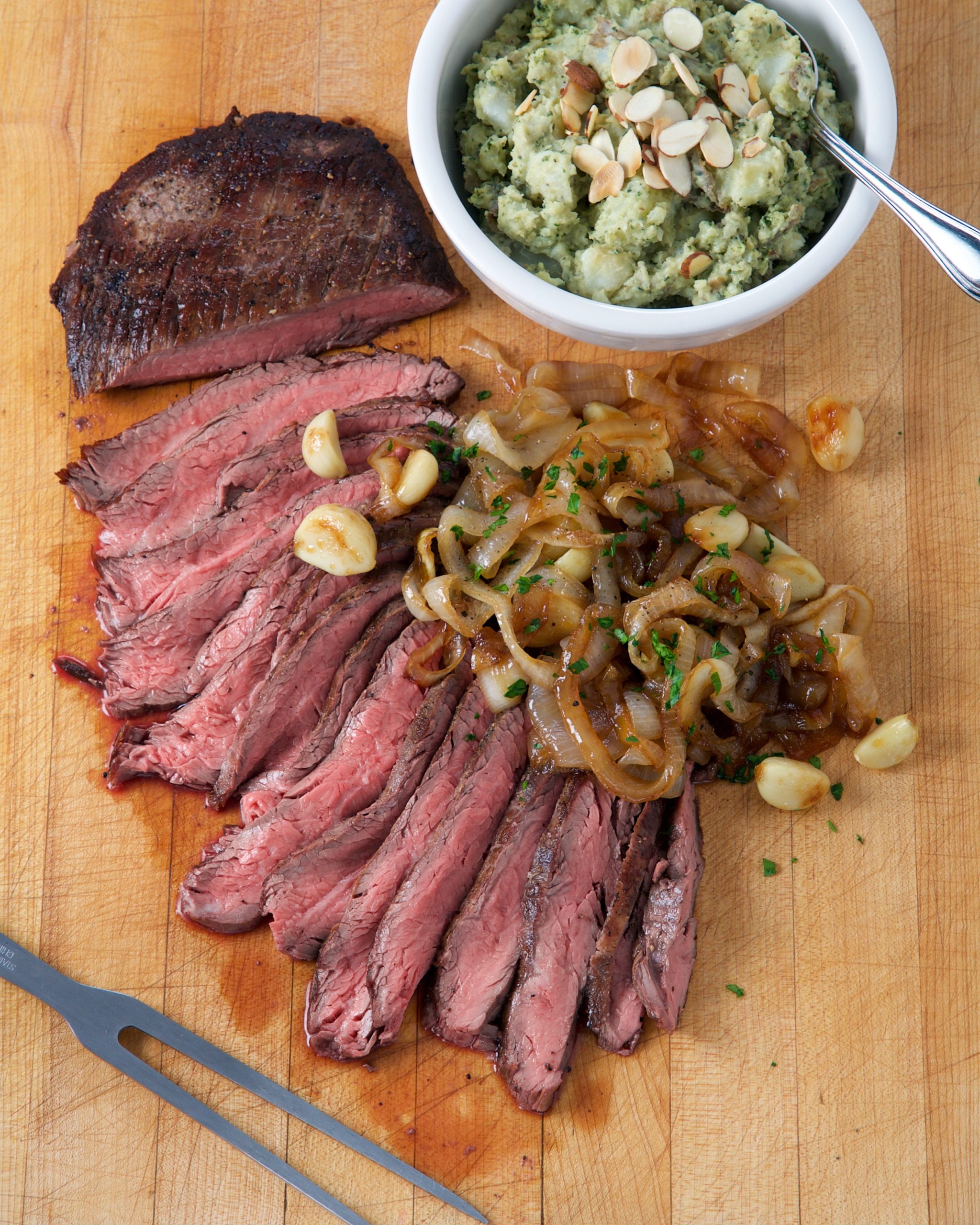 Flank Steak with Caramelized Onions and Roasted Garlic Rose Reisman